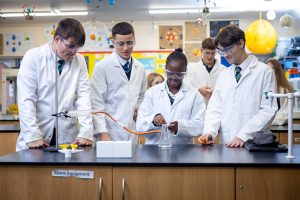 Pupils learning in a science classroom at Holme Grange School